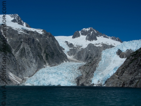 The northwestern glacier reaches about 1/2 mile from side to side. It's split into two 'lobes' by a rock face. 