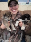 Kassie poses with a couple pups!